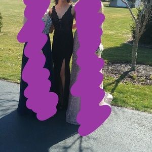 Size 0 Faviana long tight fit dress with slit.